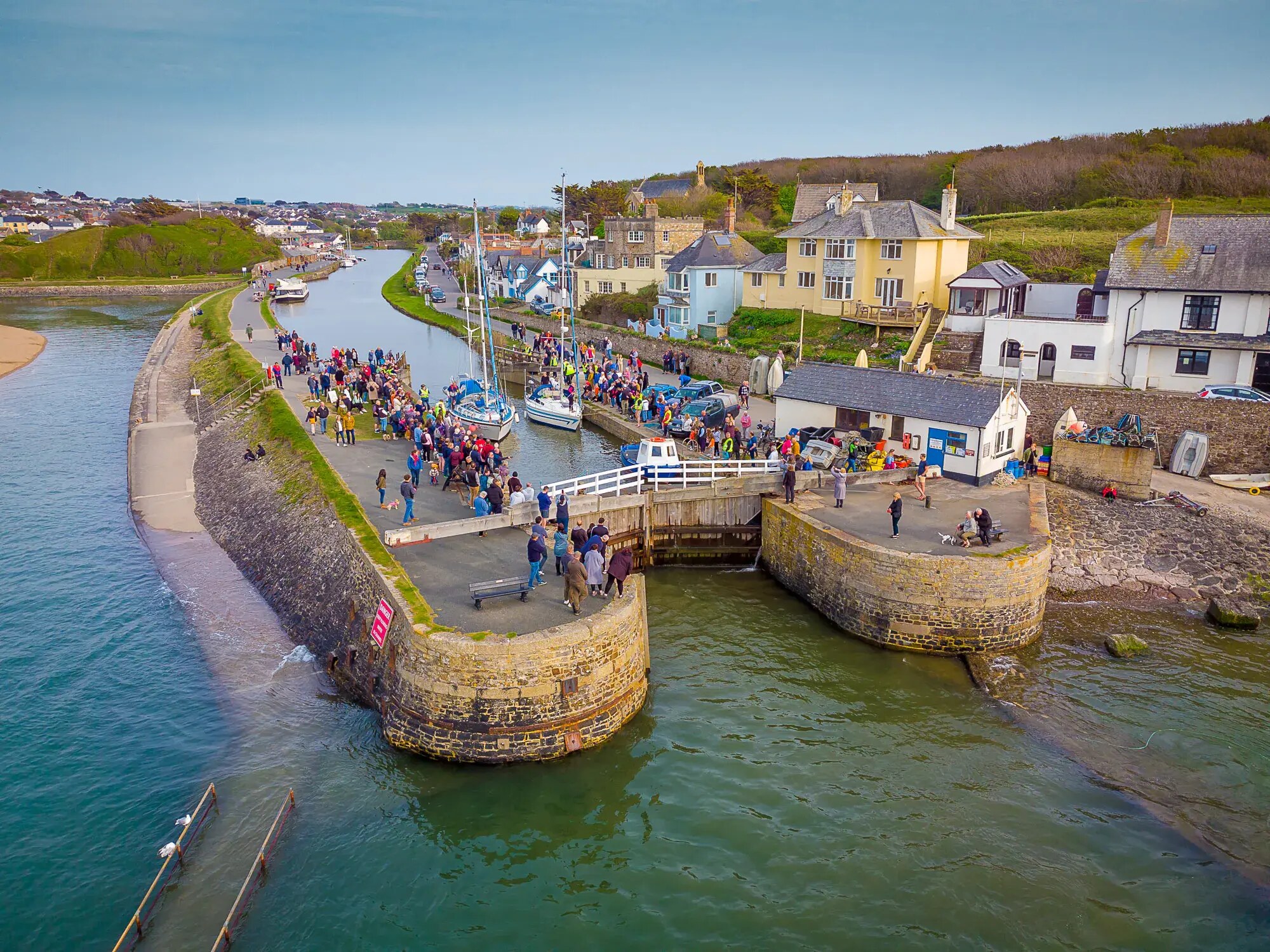 Aerial view of Bude Canal sea lock, harbour and surrounding buildings