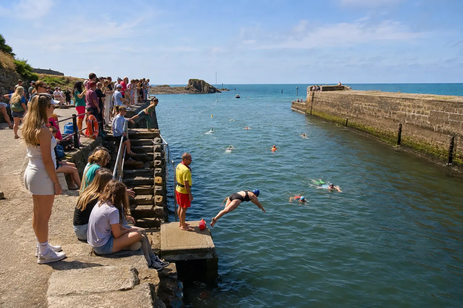 People enjoying the water beside Bude Canal sea lock