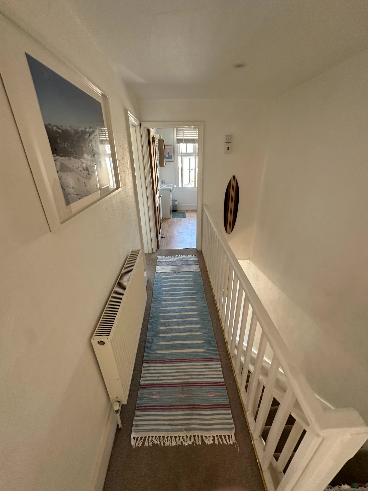 First-floor hallway leading towards the family bathroom