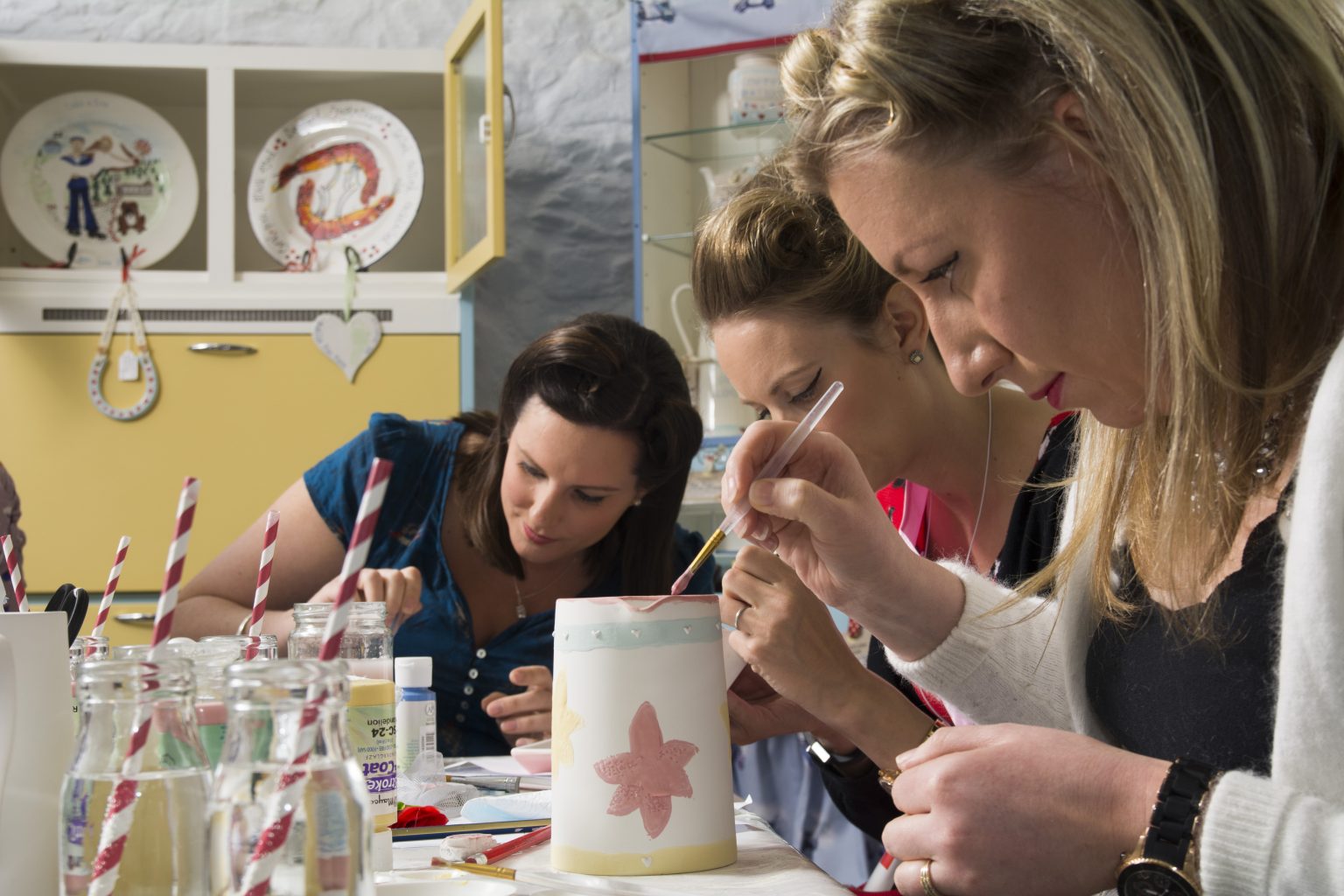 Pottery being decorated during a workshop at The Kitchen Front in Bude