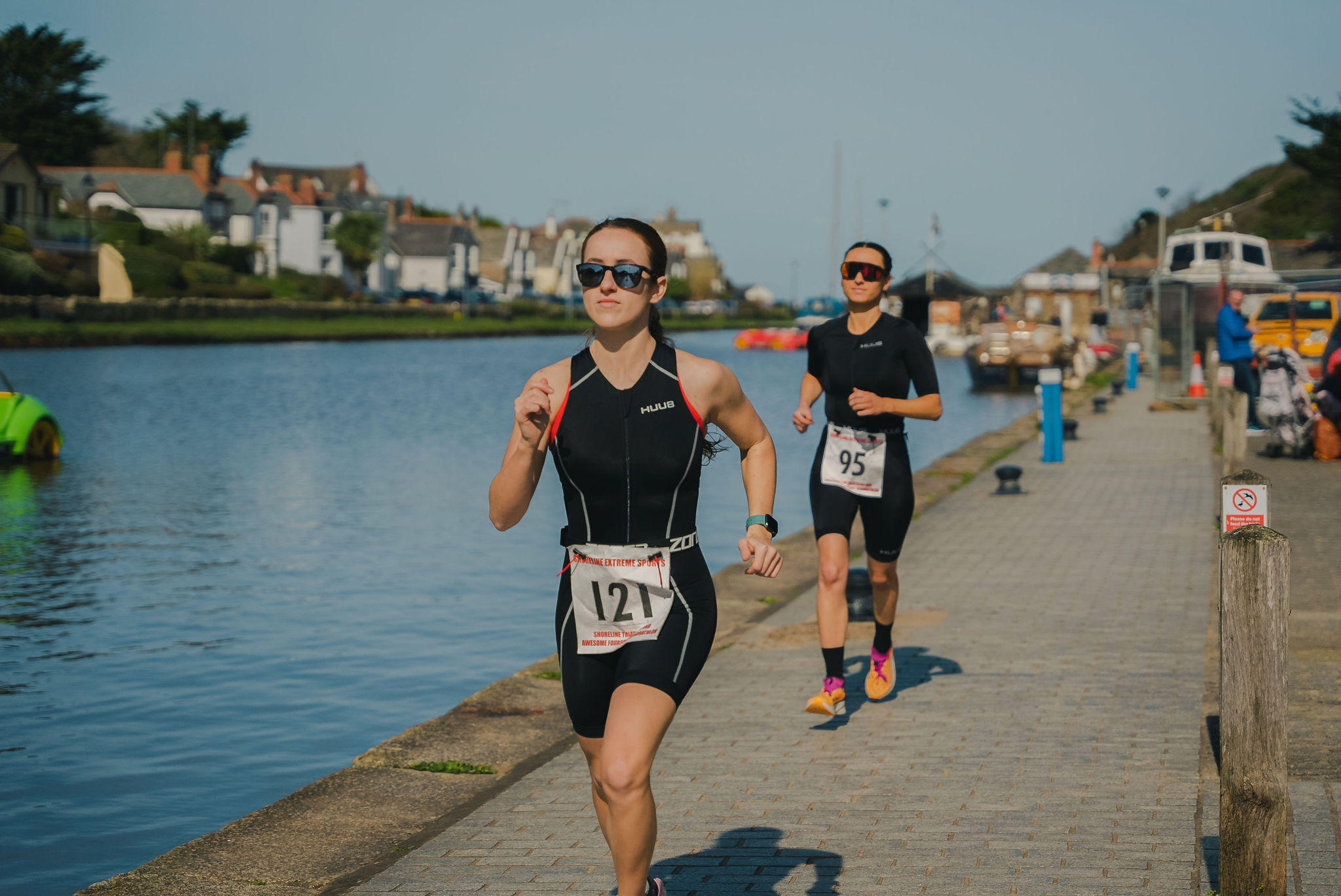 Competitors running beside Bude Canal during the Shoreline Triathlon