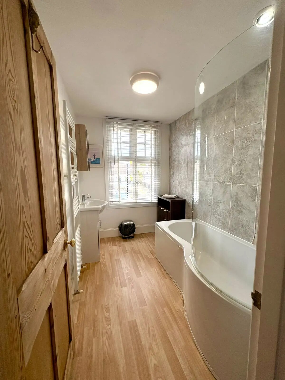 Family bathroom with bath and shower at Bude Surf Shack