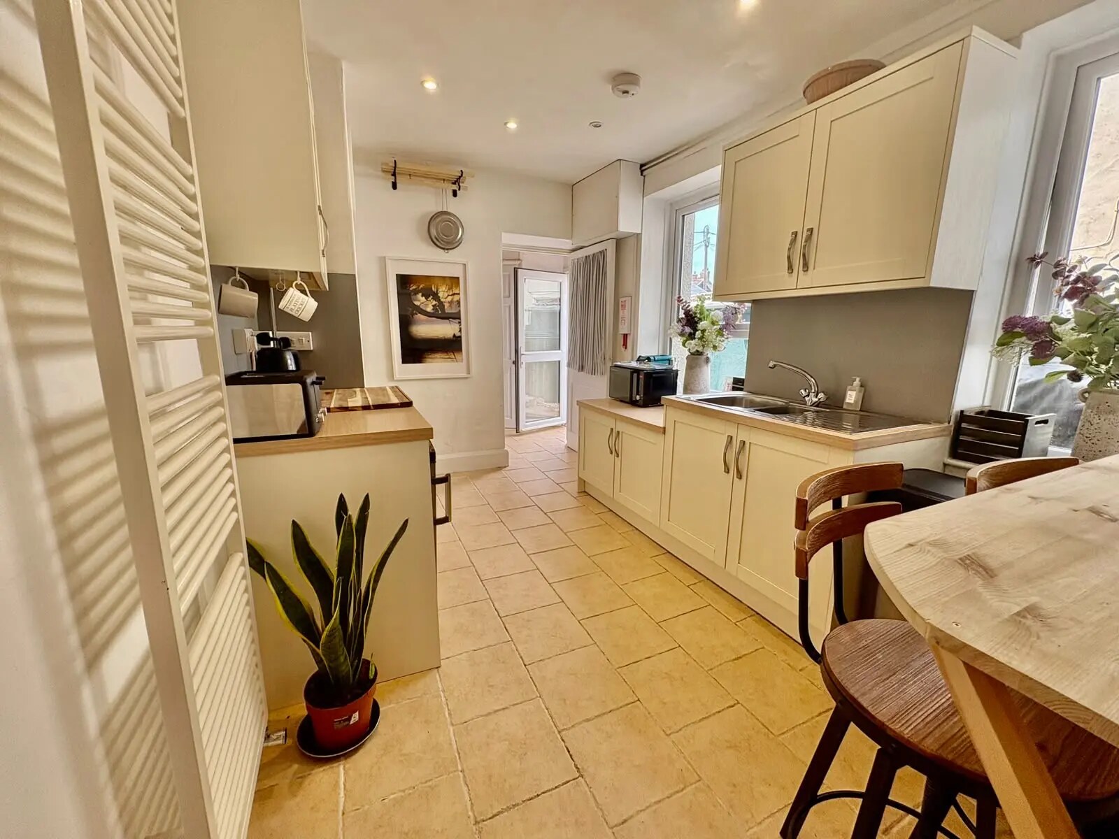 Bright fitted kitchen with wooden worktops at Bude Surf Shack